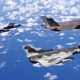 ATAC Hawker Hunter and Kfir fighter jets flying in formation with a US Navy F-35C.